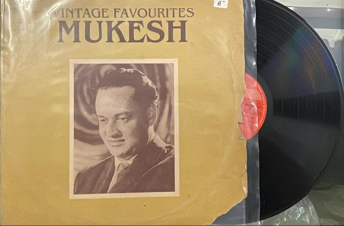 Vinyl record with a cover featuring a portrait and 'Mukesh' branding.