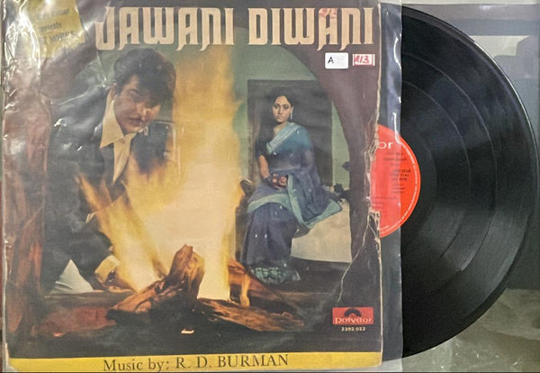 Vinyl record with a cover featuring two people and text, on a plain background.