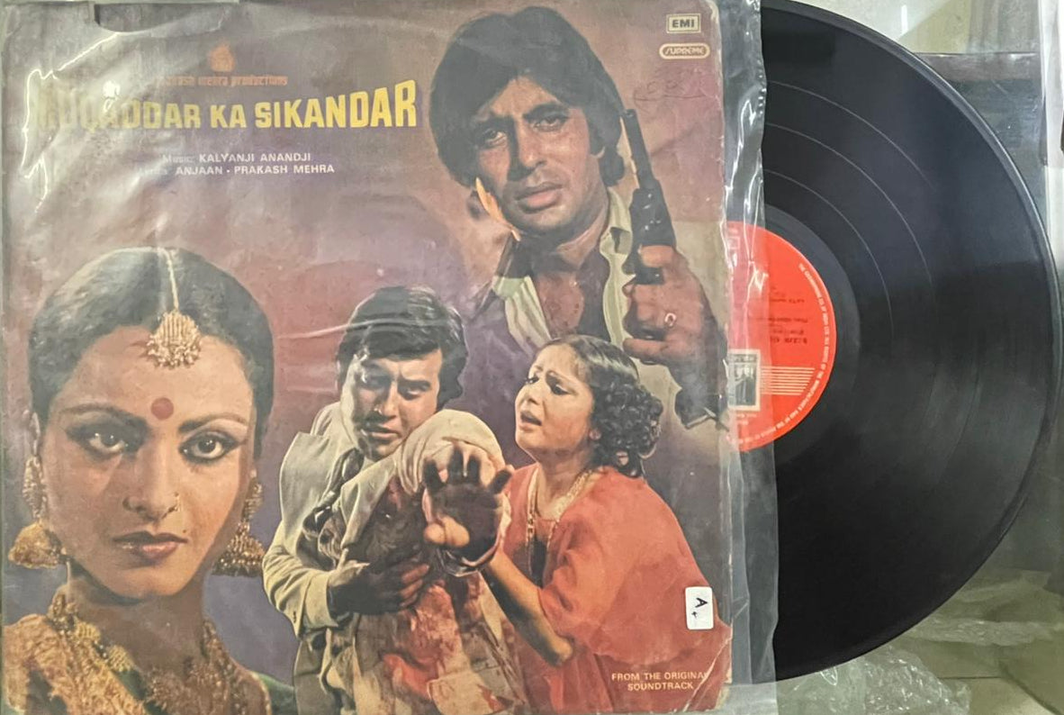 Vinyl record with a cover featuring a group of people, likely from a movie or theatrical performance.