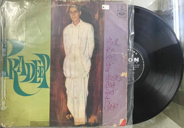 Vinyl record with a colorful cover featuring artistic design and text.