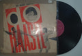 Vinyl record with a cover featuring a person and text on a white background