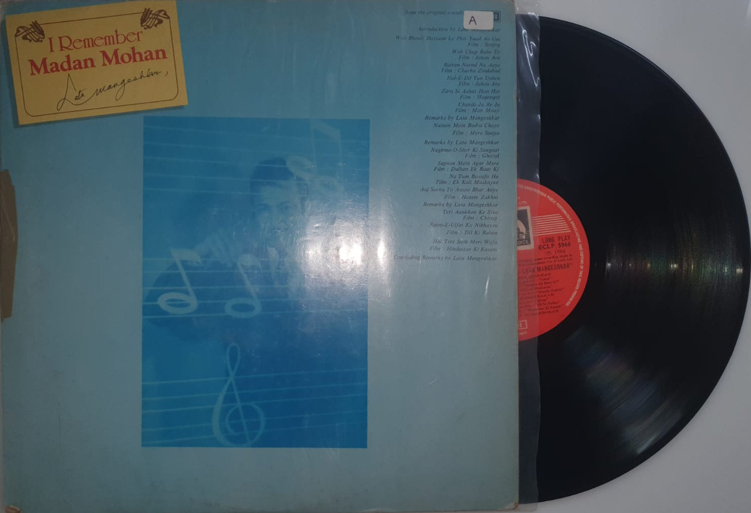 Vinyl record with a blue cover and red label on a white background