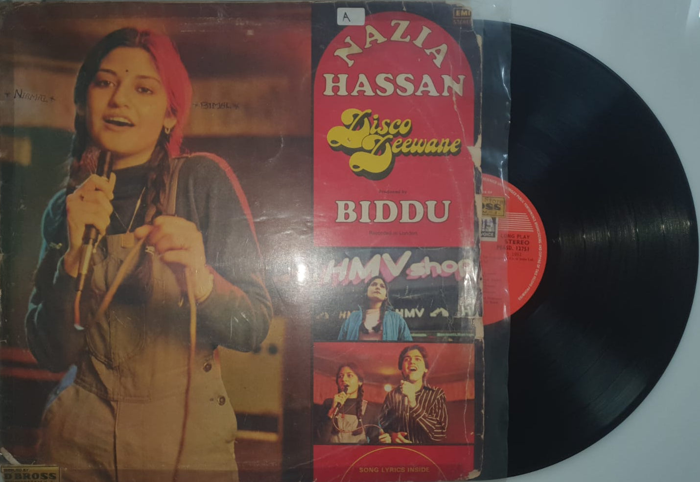 Vinyl record with a colorful cover featuring a person holding a microphone, on a white background.