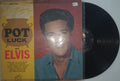 Vinyl record with a colorful cover featuring a face and text, on a white background.