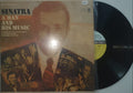 Vinyl record with cover featuring a portrait and text on a white background
