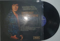 Vinyl record with a cover featuring a person's face and 'Decca' branding.