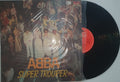 Vinyl record with 'ABBA Super Trouper' cover on a white surface