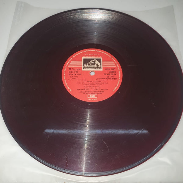 Vinyl record with a red label on a white background