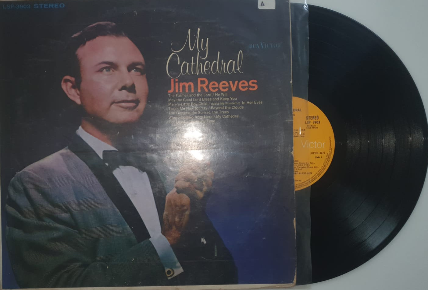 Vinyl record with a cover featuring a portrait of a man and the text 'My Father Jim Reeves'.